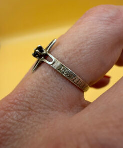 Religious ring with a cross and a blue stone, size N with the engraving: “Save and protect”