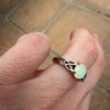 Nickel opal ring, size K.