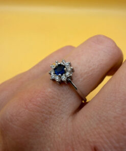 Silver ring with blue and clear cubic zirconia, size O.#119