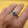 Silver ring with blue and clear cubic zirconia, size O.#119