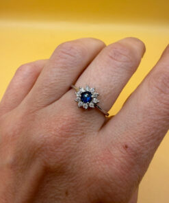 Silver ring with blue and clear cubic zirconia, size O.#119