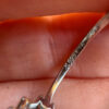 Silver ring with blue and clear cubic zirconia, size O.#119