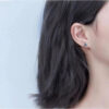 Sterling Silver Articulated Triangle Stud Earrings.