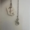 Silver-colored pendant with chain