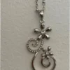 Silver-colored pendant with chain