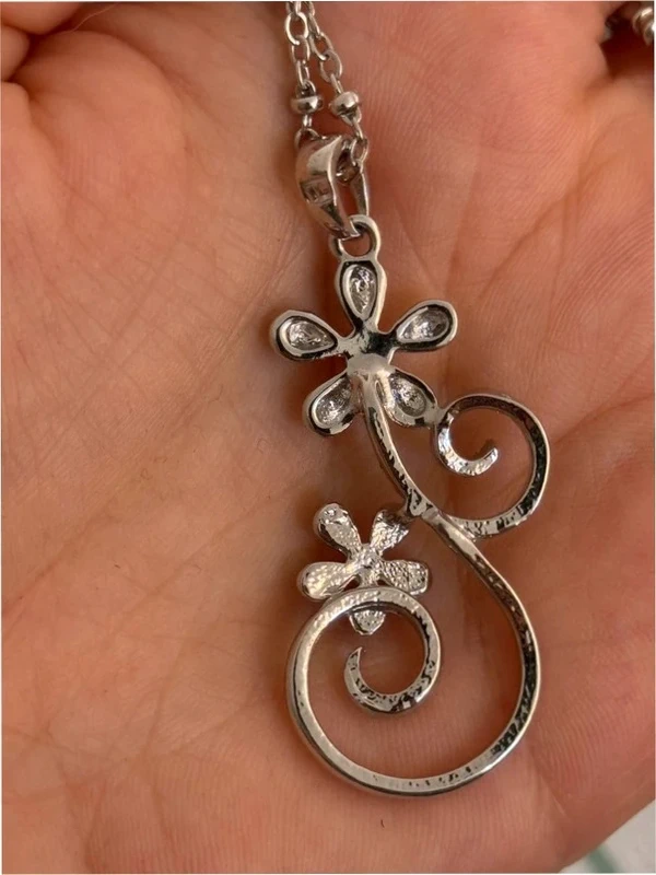 Silver-colored pendant with chain