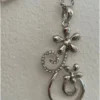 Silver-colored pendant with chain