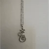 Silver-colored pendant with chain