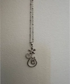 Silver-colored pendant with chain