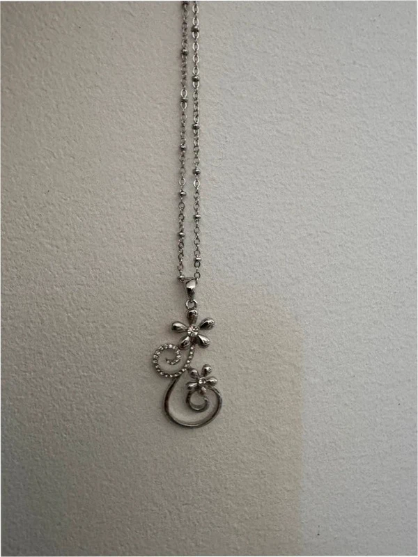 Silver-colored pendant with chain