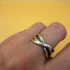 sterling silver wave ring features a distinctive intertwined design Uk size M