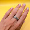 sterling silver wave ring features a distinctive intertwined design Uk size M