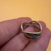 sterling silver wave ring features a distinctive intertwined design Uk size M