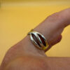 sterling silver wave ring features a distinctive intertwined design Uk size M
