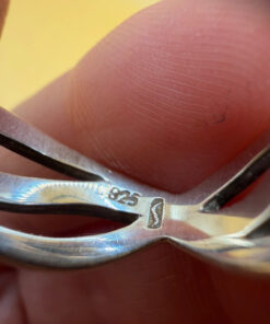 sterling silver wave ring features a distinctive intertwined design Uk size M