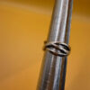sterling silver wave ring features a distinctive intertwined design Uk size M
