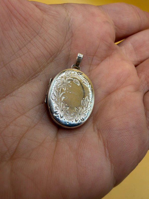 Germany vintage sterling silver oval locket features detailed engraved floral motifs~108