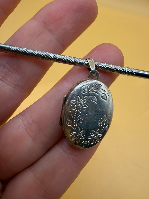 Germany vintage sterling silver oval locket features detailed engraved floral motifs~108