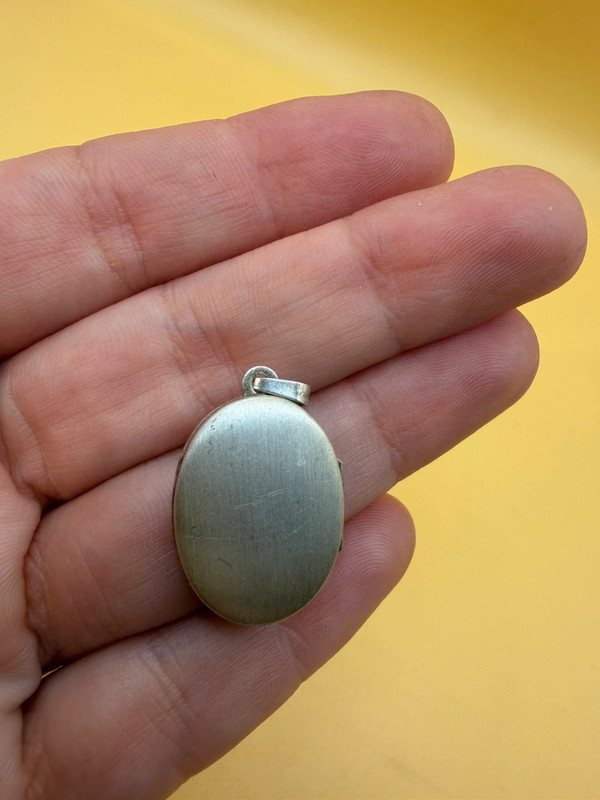 Germany vintage sterling silver oval locket features detailed engraved floral motifs~108