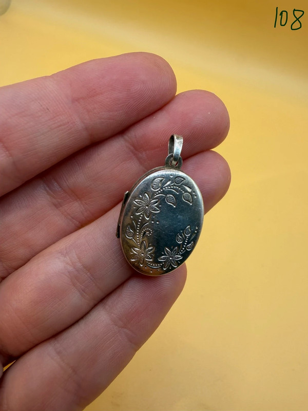 Germany vintage sterling silver oval locket features detailed engraved floral motifs~108