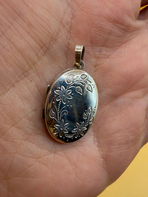 Germany vintage sterling silver oval locket features detailed engraved floral motifs~108