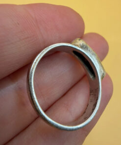 A silver ring featuring a natural opal, size Q