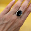 Men Unisex silver ring featuring a natural onyx, size W