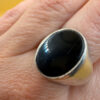 Men Unisex silver ring featuring a natural onyx, size W