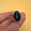Men Unisex silver ring featuring a natural onyx, size W
