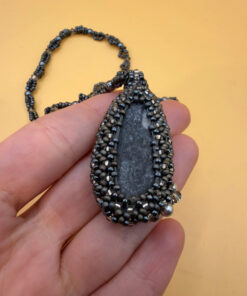 Necklace with a polished Orthoceras fossil cabochon and beads