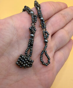 Necklace with a polished Orthoceras fossil cabochon and beads