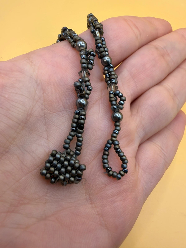Necklace with a polished Orthoceras fossil cabochon and beads.