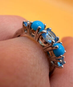 A silver ring, size P, with natural topaz and turquoise stones