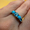 A silver ring, size P, with natural topaz and turquoise stones