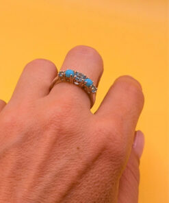 A silver ring, size P, with natural topaz and turquoise stones