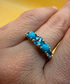A silver ring, size P, with natural topaz and turquoise stones