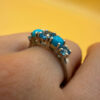 A silver ring, size P, with natural topaz and turquoise stones