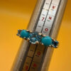 A silver ring, size P, with natural topaz and turquoise stones