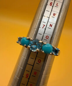 A silver ring, size P, with natural topaz and turquoise stones