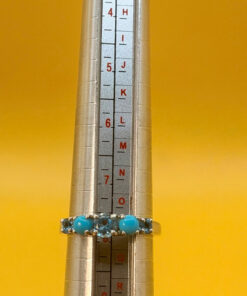 A silver ring, size P, with natural topaz and turquoise stones