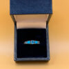 A silver ring, size P, with natural topaz and turquoise stones