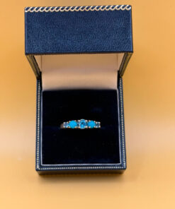 A silver ring, size P, with natural topaz and turquoise stones