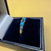 A silver ring, size P, with natural topaz and turquoise stones