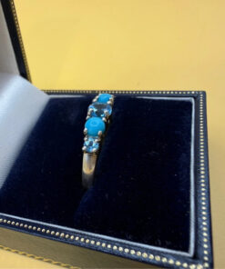 A silver ring, size P, with natural topaz and turquoise stones
