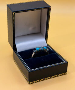A silver ring, size P, with natural topaz and turquoise stones
