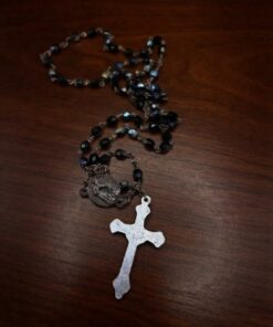 Vintage Italian rosary, c. 1950s–1970s. Five decades of black faceted Czech glass beads with an aurora borealis finish