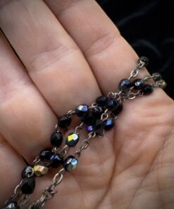 Vintage Italian rosary, c. 1950s–1970s. Five decades of black faceted Czech glass beads with an aurora borealis finish