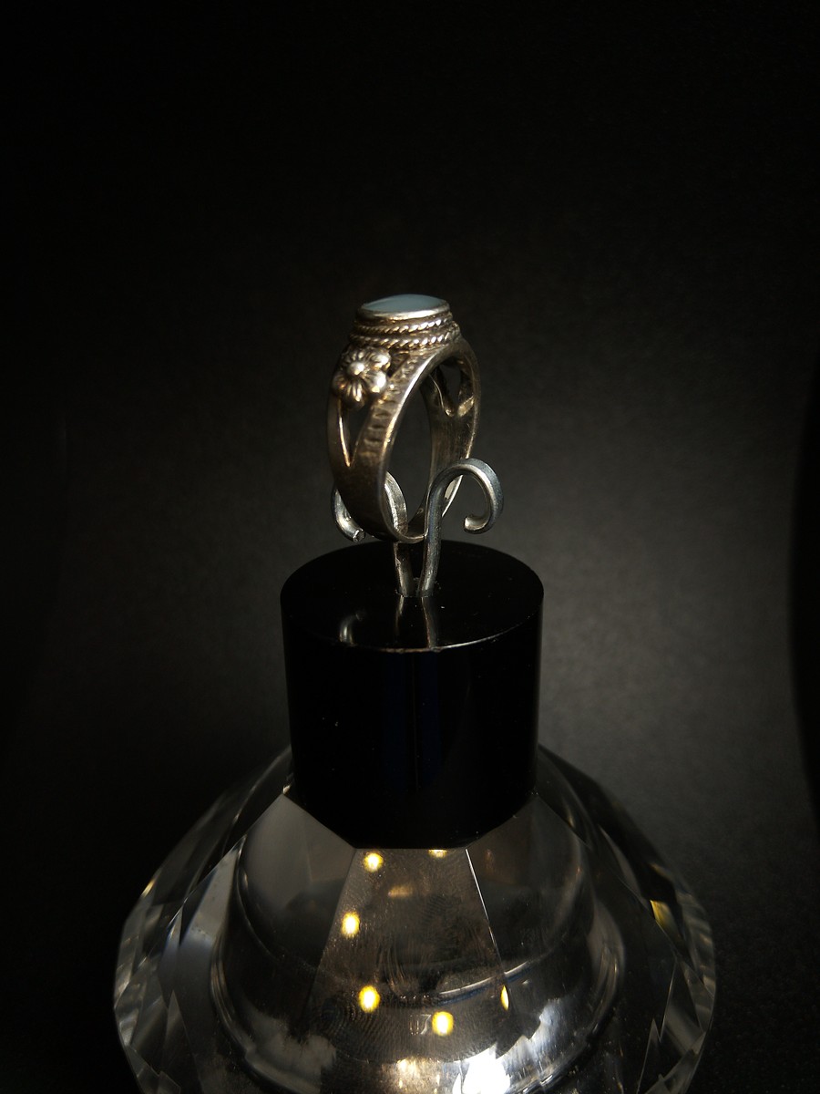 silver ring with a moonstone, adorned with floral patterns. Size R — 360° view